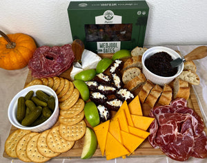 Charcuterie board with stuffed dates and date jam.