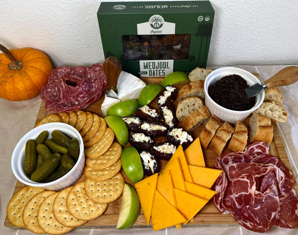 Charcuterie board with stuffed dates and date jam.